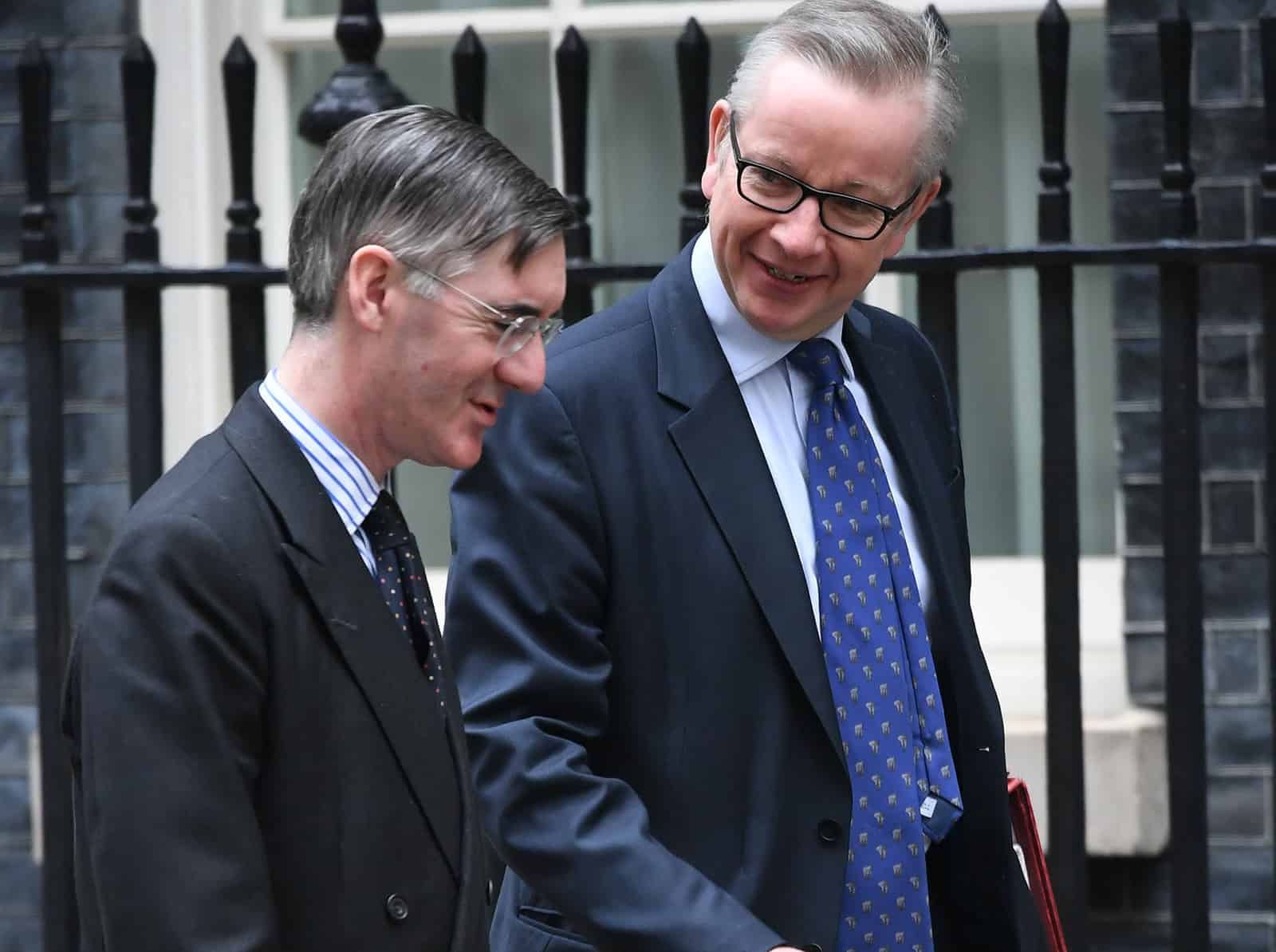 Michael Gove and Jacob Rees-Mogg trade blows across conference floor