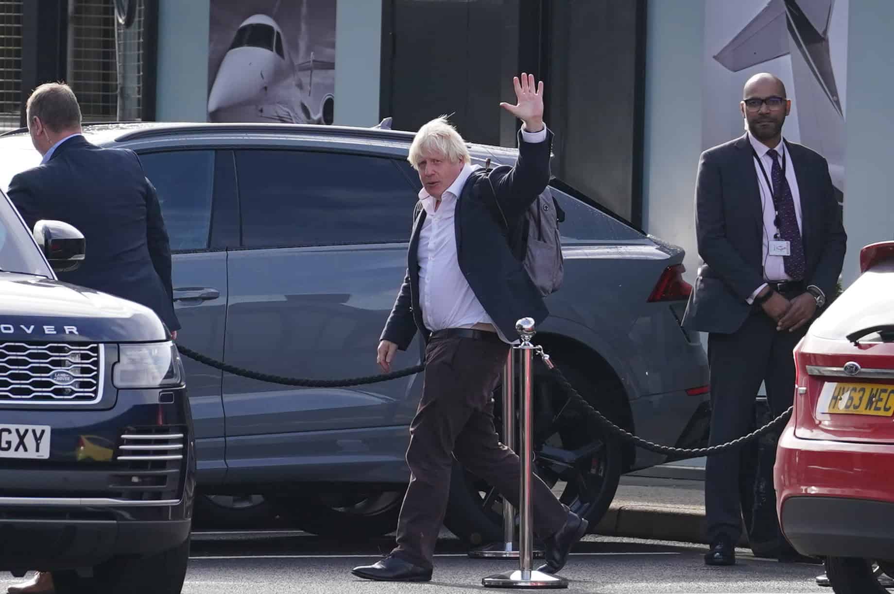 Boris Johnson arrives back in UK as Tories split on his expected leadership bid