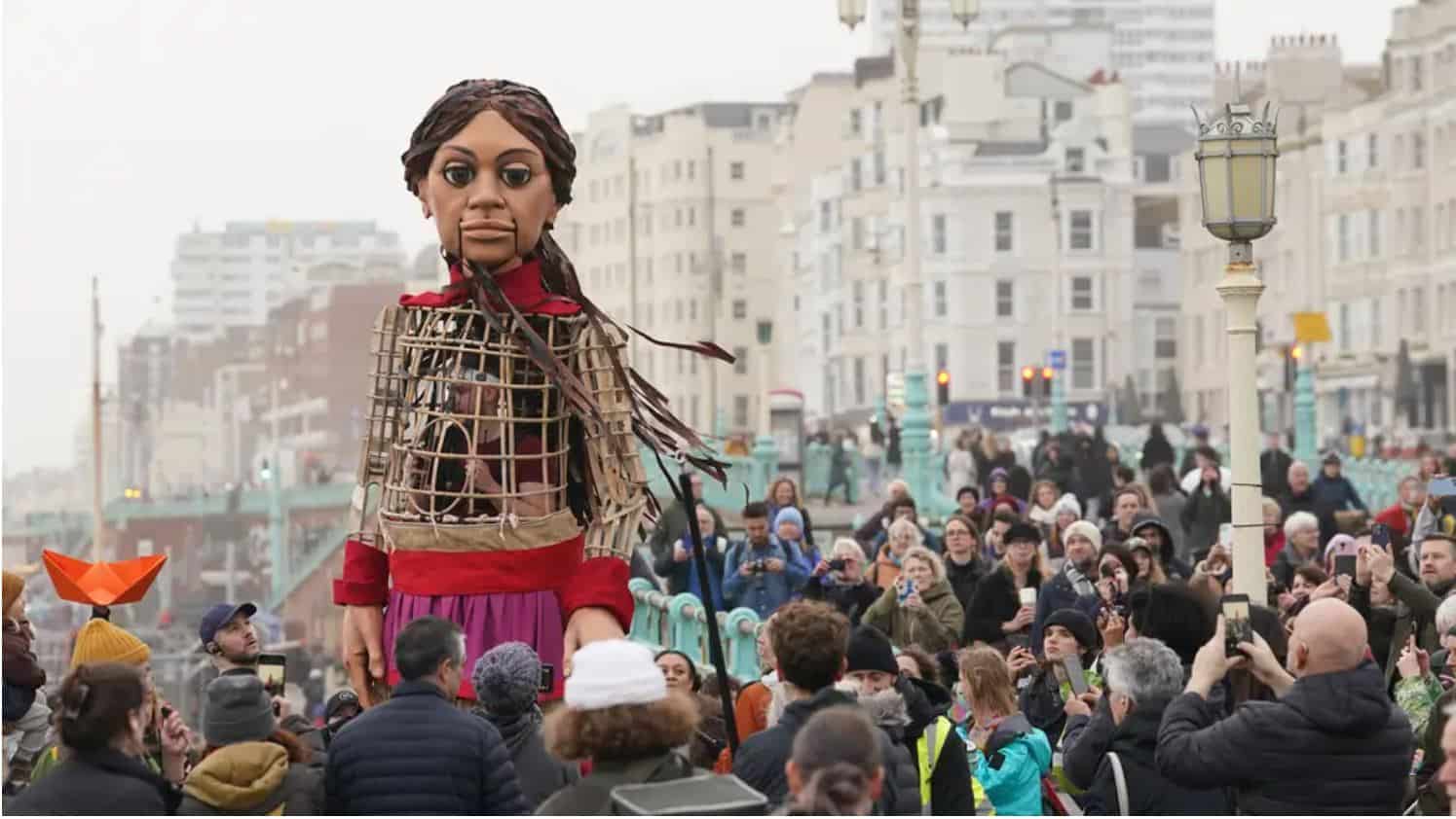 Giant puppet Little Amal leads walk in Brighton