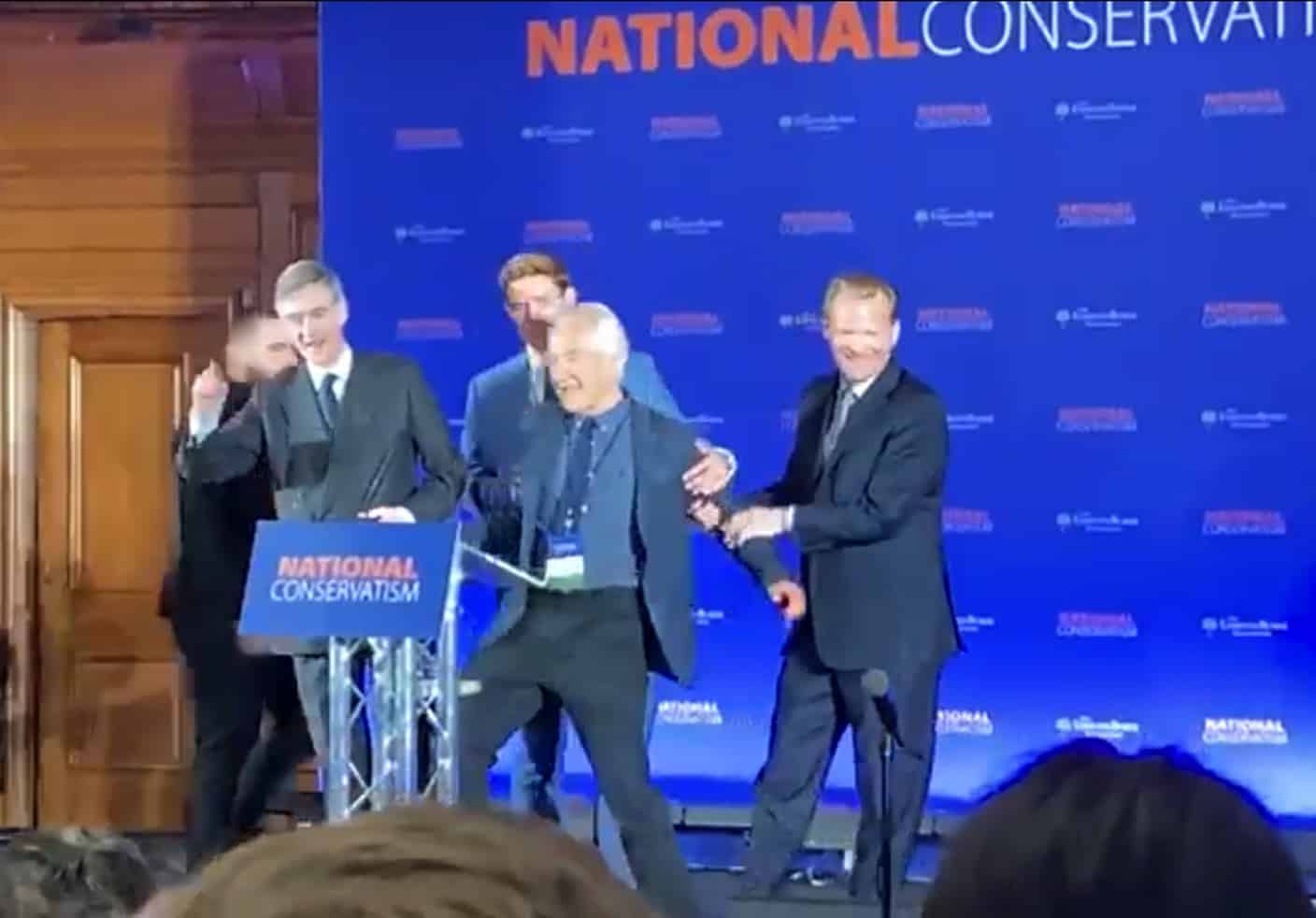 Protester storms stage during Rees-Mogg’s speech to warn of ‘fascism’