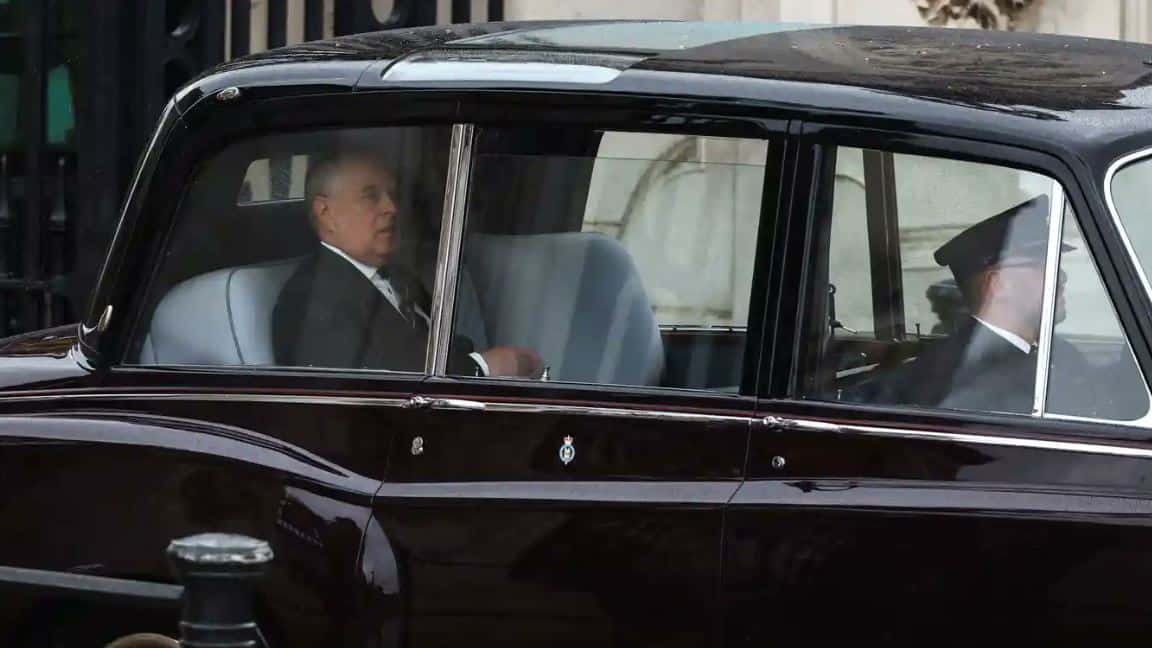Duke of York Prince Andrew booed as he is driven down The Mall for coronation