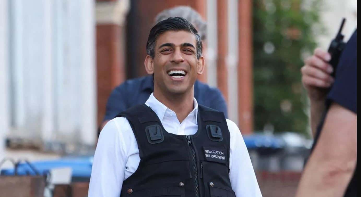 Rishi Sunak seen laughing as he watches immigration raid